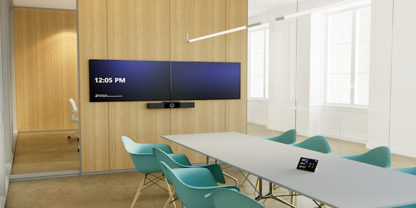A wood paneled conference room set up with new dual monitors for video conferencing from Data Projections
