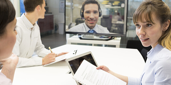 Business people a video conference call with a Data Projections specialist