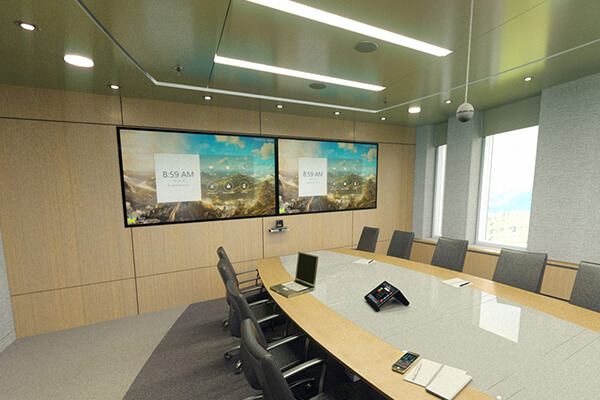 A boardroom set up with dual TVs for video conferencing
