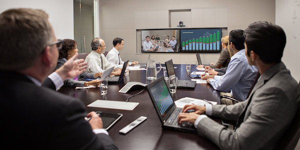 Government employees looking over data while on a conference call