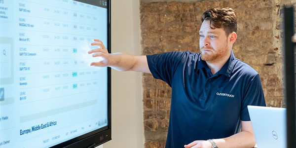 A man struggling with an interactive display screen