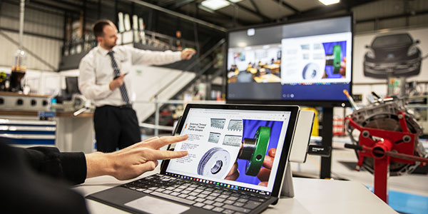 A laptop utilizing Barco's ClickShare Conference to connect all of the room's conferencing peripherals