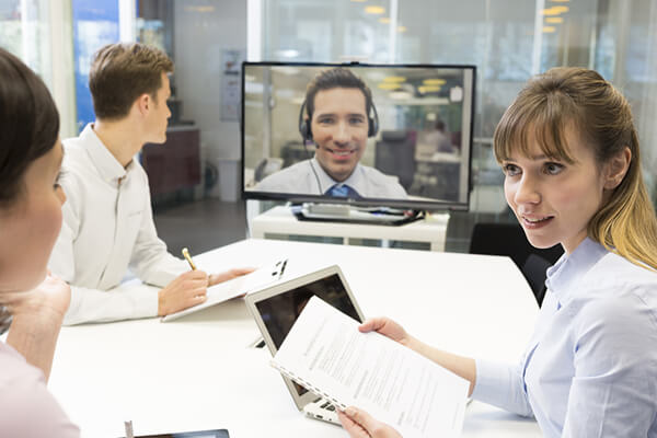 Business people a video conference call with a Data Projections specialist