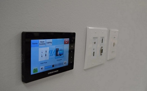 The new AV control systems mounted on the wall of Aviall's new training room